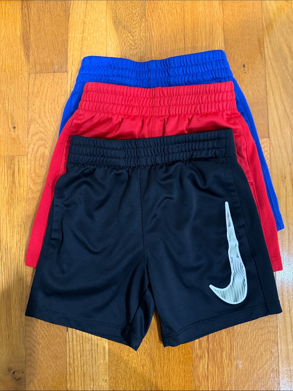 Nike Kids Athletic Shorts Trio in Black, Red & Blue 4 XS